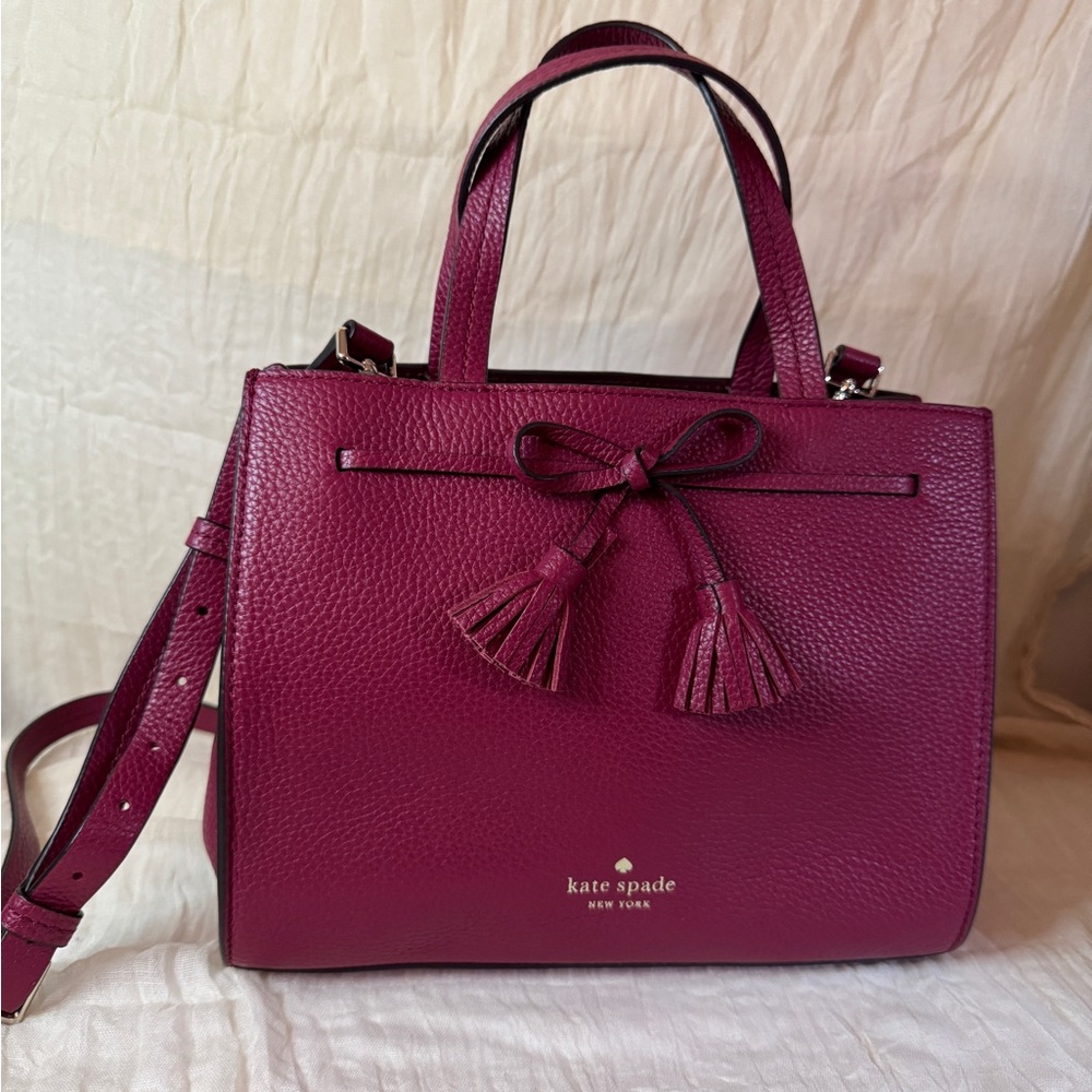 kate spade pebbled leather satchel in magenta with bow tassels